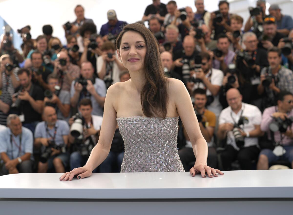 Marion Cotillard poses for photographers.