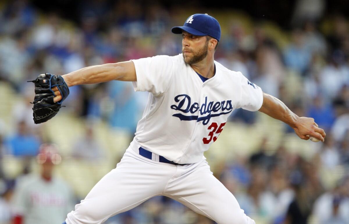 Dodgers starter Chris Capuano delivers a pitch during the first inning of the Dodgers' 16-1 loss to the Philadelphia Phillies on Friday.