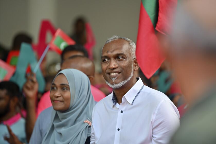 Maldives' main opposition candidate Mohamed Muiz participates in a rally as he concludes his campaign for the second round of presidential election in capital Male, Maldives, Friday, Sept.29, 2023. Maldivians return to the polls Saturday, Sept.30 to vote in a runoff election between the top two candidates in the country's presidential race after neither secured more than 50% in the first round earlier this month. (AP Photo/Mohamed Sharuhaan )