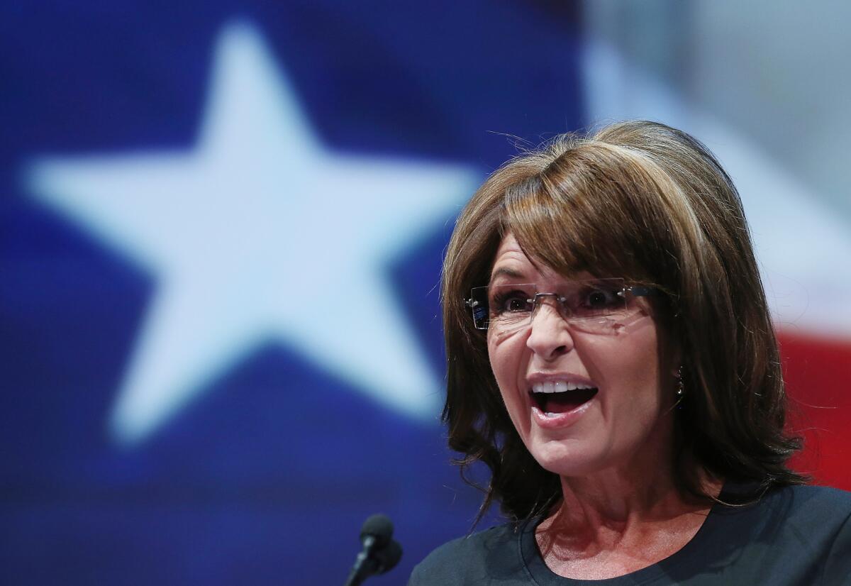 Former Alaska Gov. Sarah Palin, shown in 2013, thinks the "Politically Correct Police" are going to bust Mike Ditka for speaking his mind about the Redskins' name.