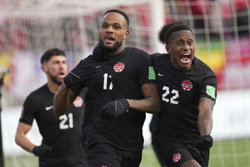 Canada's Cyle Larin celebrates after scoring a goal against the U.S. during a World Cup qualifier 
