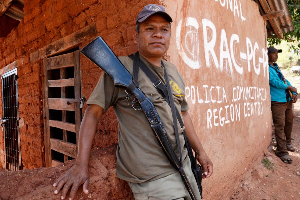 Bernardino Sánchez Luna, founder of the "community police" group that he says was founded to protect 16 indigenous villages from the Los Ardillos gang, patrols a command post in the hamlet of Rincon de Chautla.