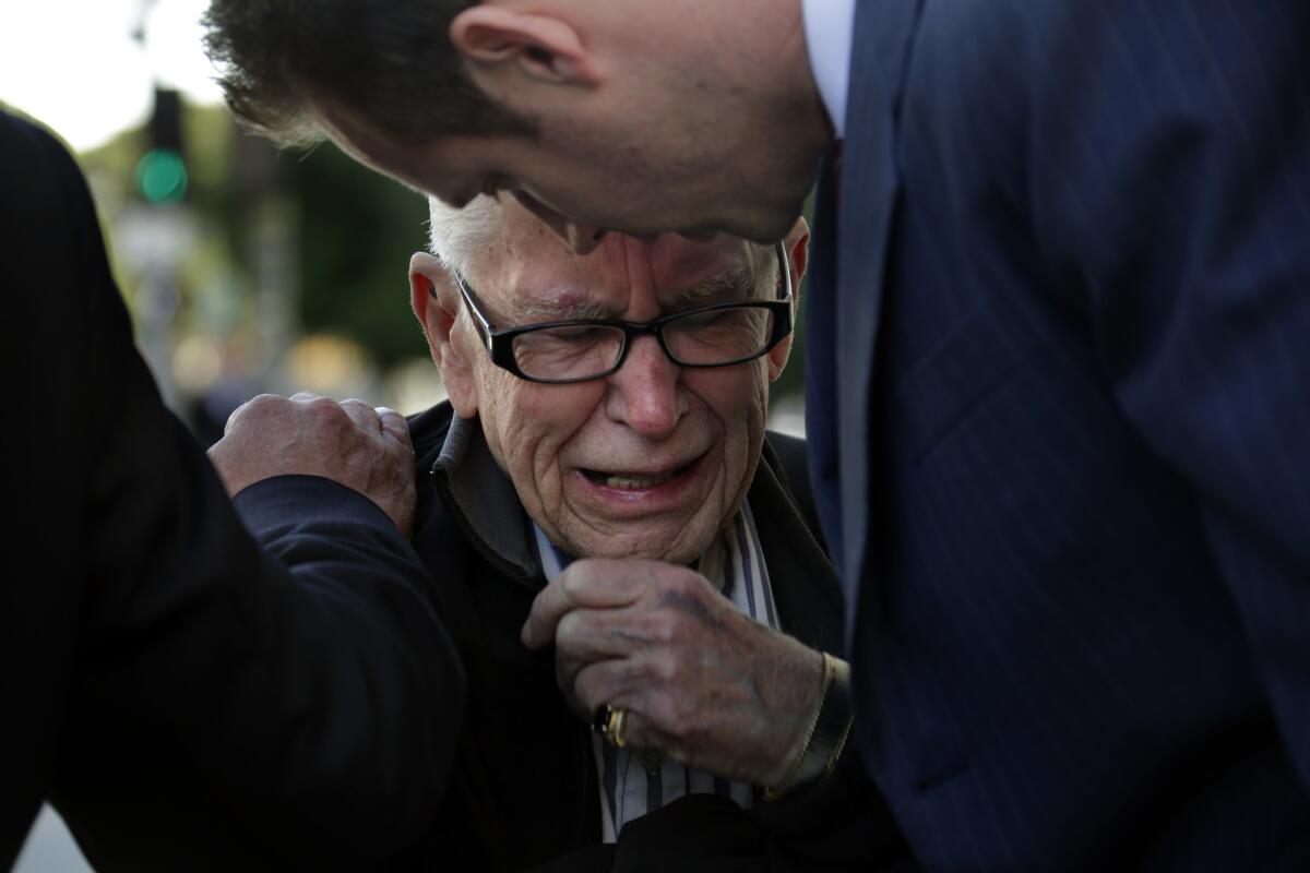 Bill Beaird, father of Brian Beaird, who was shot dead by LAPD officers following a car chase, weeps at the press conference held in front of LAPD headquarters in December.