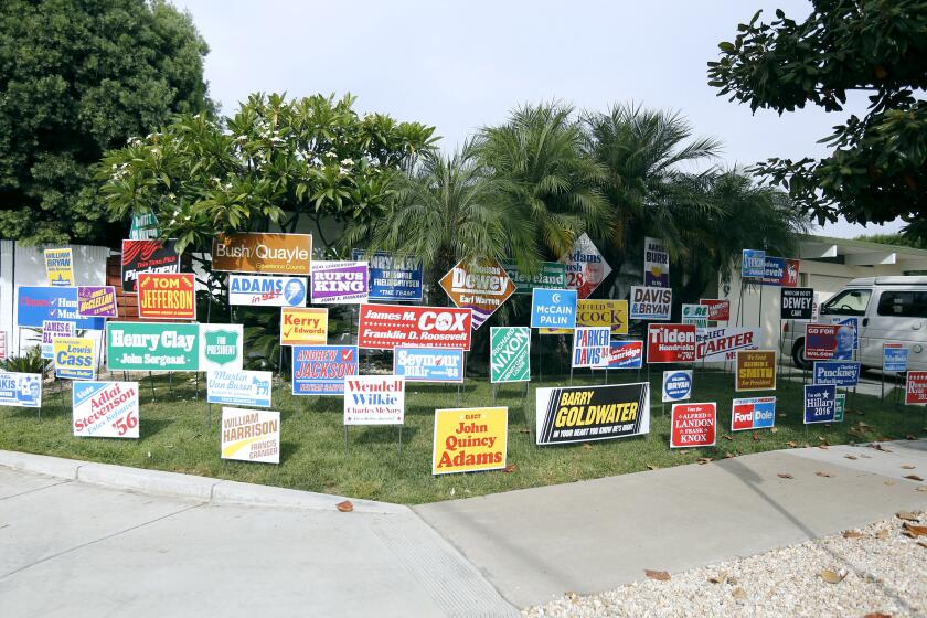 Signs put up for the "Monument to the Unelected" art installation by Nina Katchadourian on a front lawn of a home at the corner of Fairhaven and S. Oakwood St., in the city of Orange on Tuesday, Oct. 6, 2020. The installation is made up of 58 signs with the names of losing candidates from every presidential election in American history.