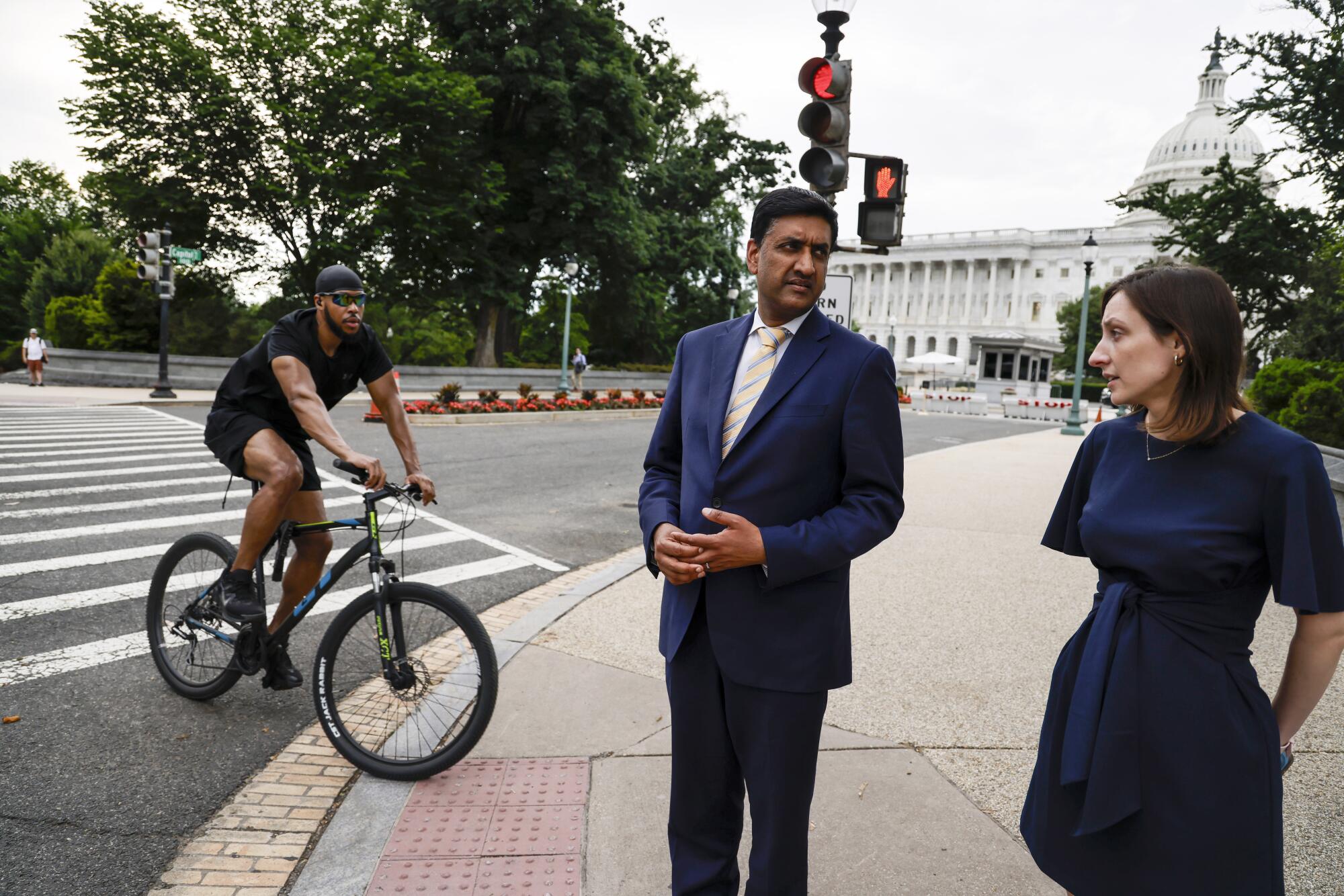 Congressman Ro Khanna, (D) of California, confers with Communications Director 