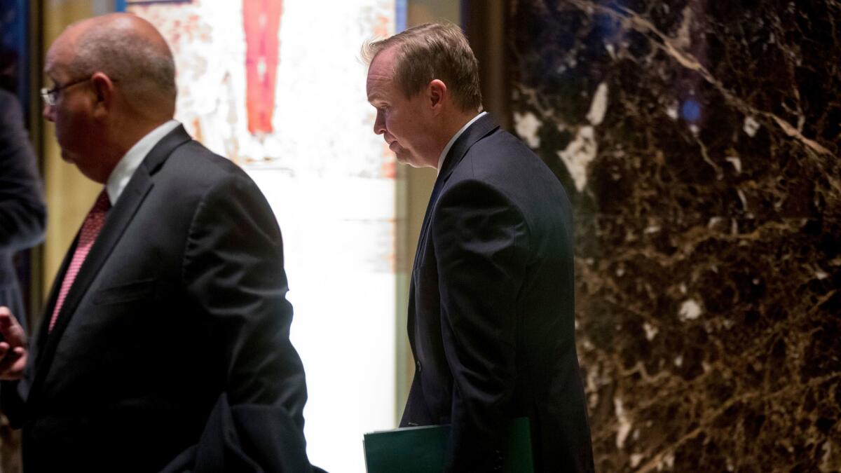 President elect-Donald Trump's pick for budget director, South Carolina Rep. Mick Mulvaney, right, leaves Trump Tower in New York on Dec. 5.