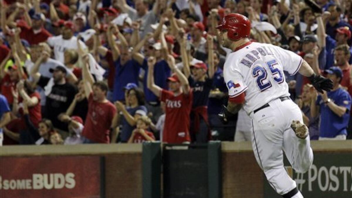 Mike Napoli hits a two-run double in the eighth inning of Game 5