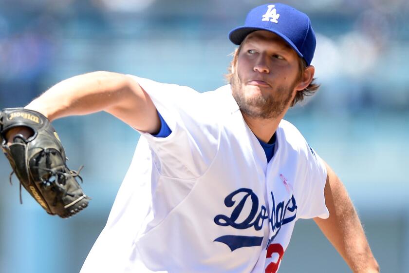Dodgers starter Clayton Kershaw delivers a pitch during the second inning of the team's 7-4 loss in 10 innings to the San Francisco Giants on Sunday.