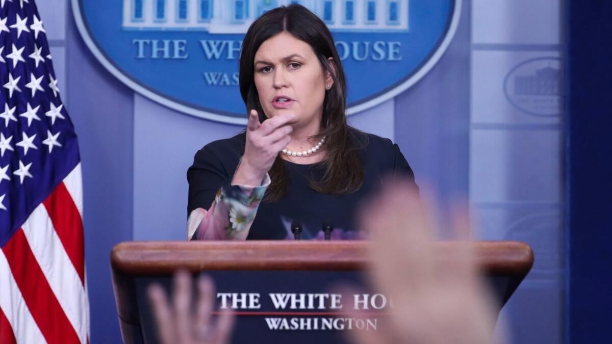 White House Press Secretary Sarah Huckabee Sanders responds to a question from the news media on Aug. 1.