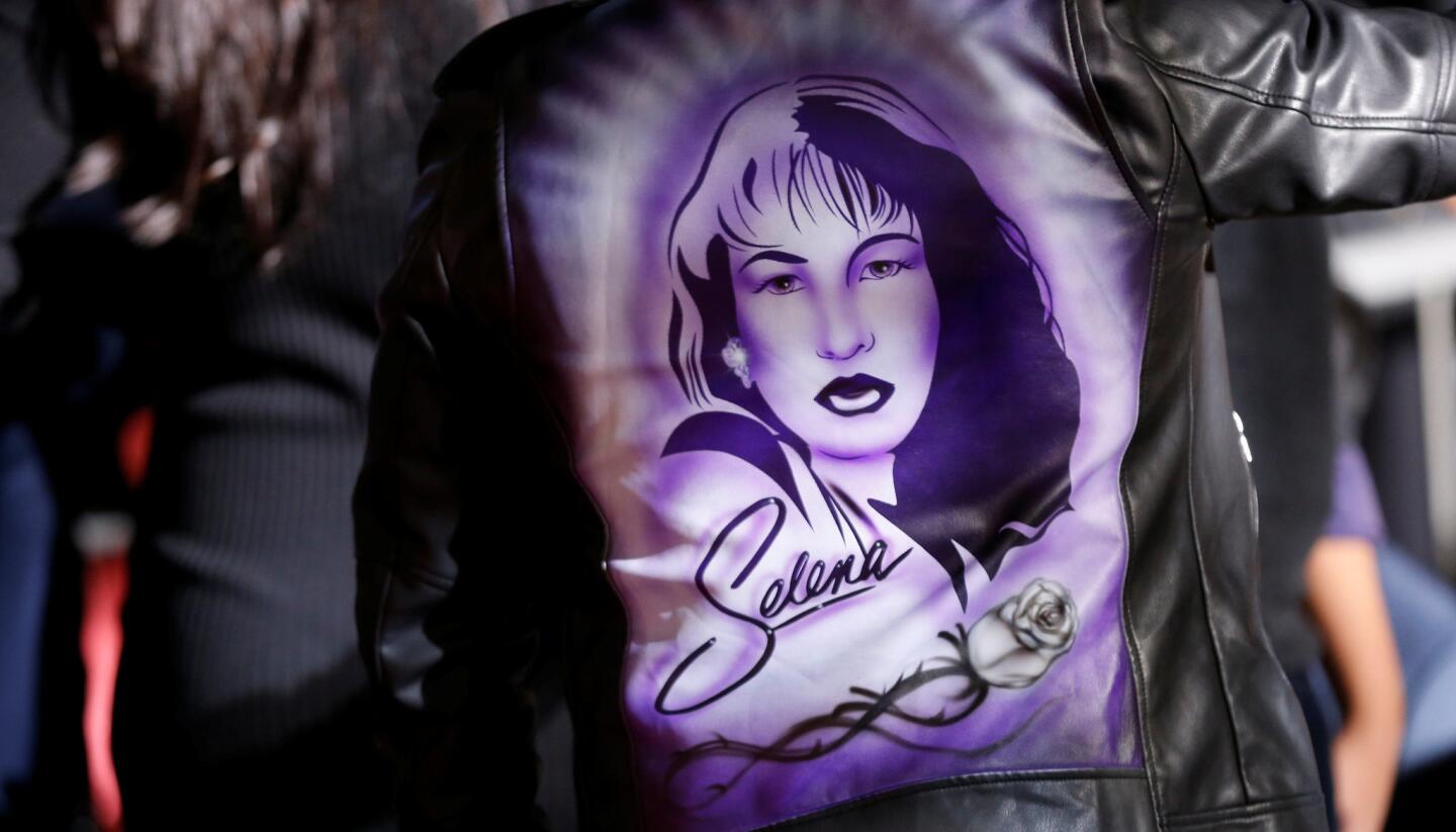 A person wears a jacket depicting late singer Selena Quintanilla-Perez at the unveiling of her star on the Hollywood Walk of Fame in Los Angeles