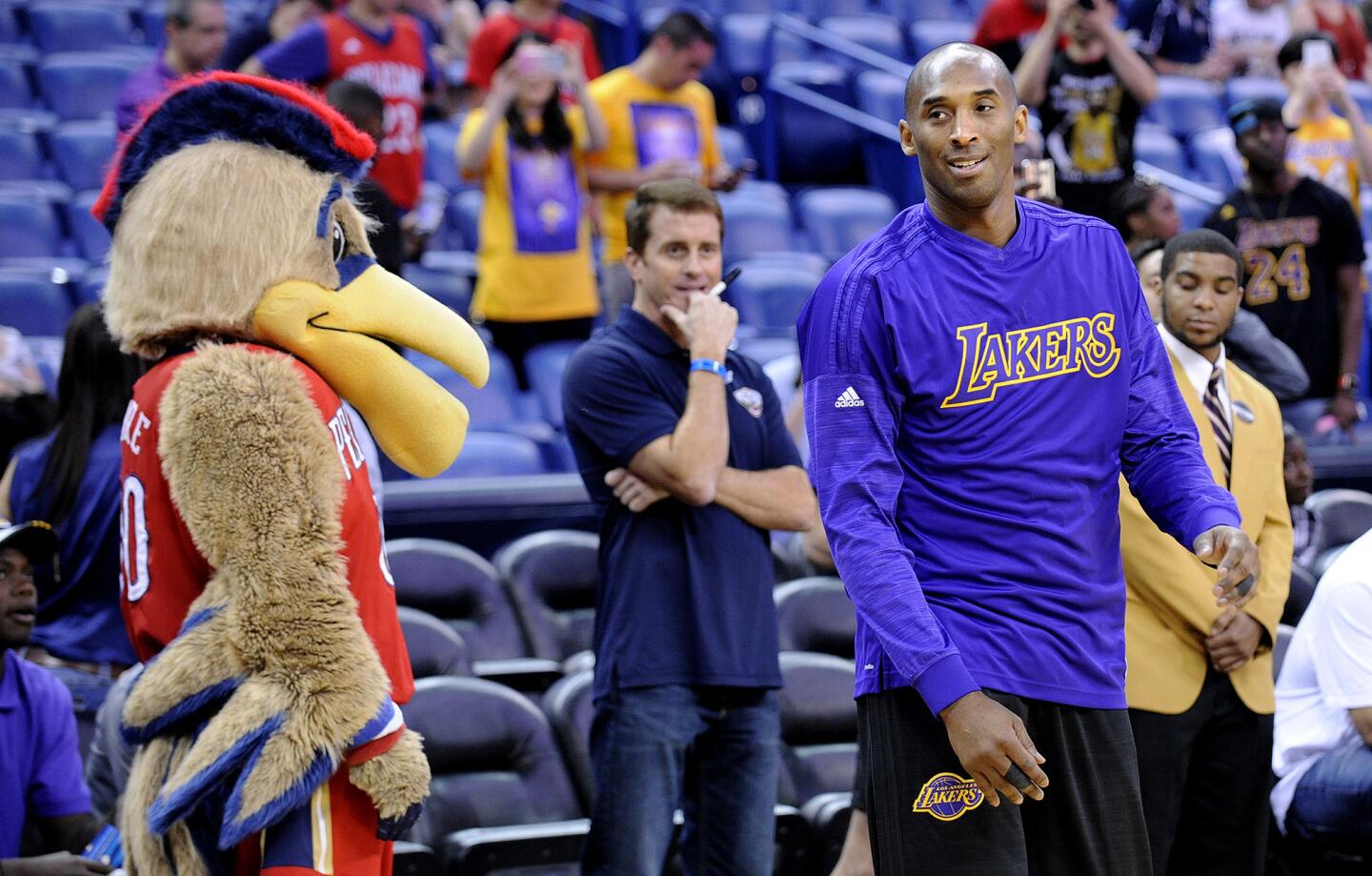 The New Orleans mascot pays a visit toKobe Bryant as he warms up for the game against the Pelicans.