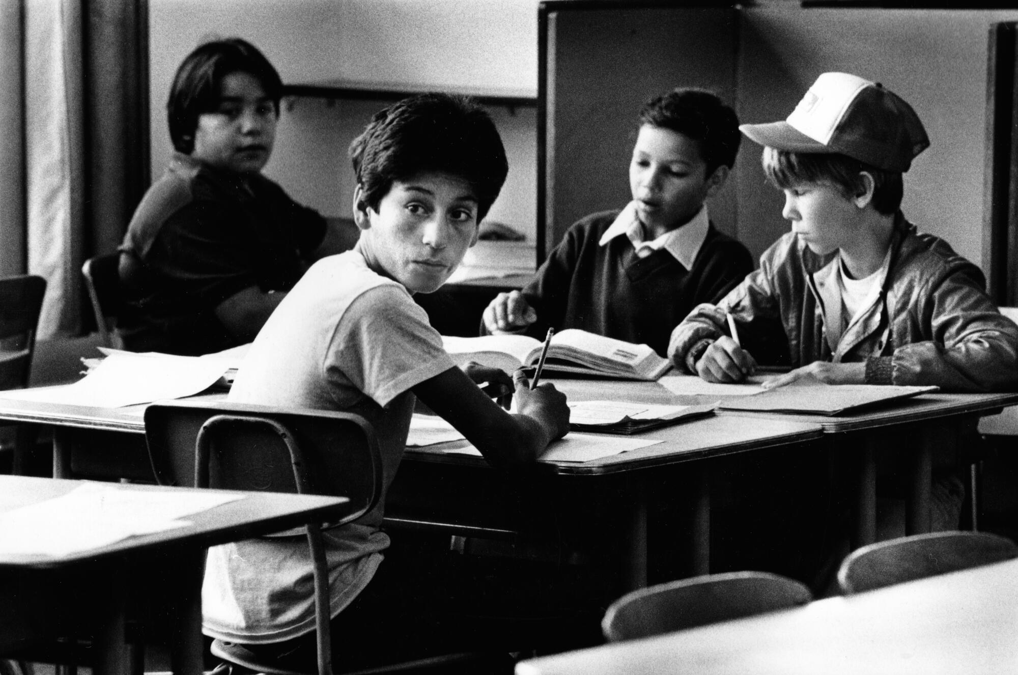 Ernie Galvez in class at Killingsworth Junior High School in Hawaiian Gardens. He is in t-shirt looking toward camera.