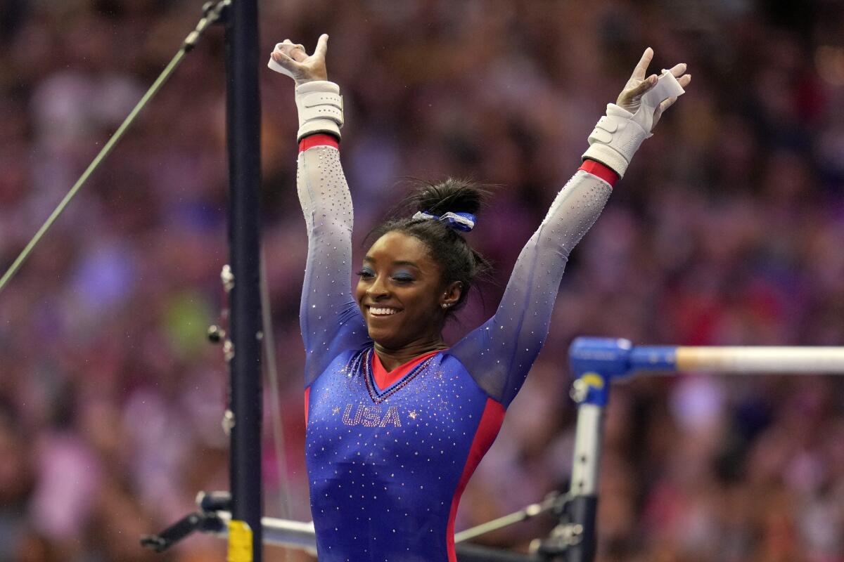 Simone Biles reacts after her uneven bars routine at the U.S. Olympic trials June 25, 2021.
