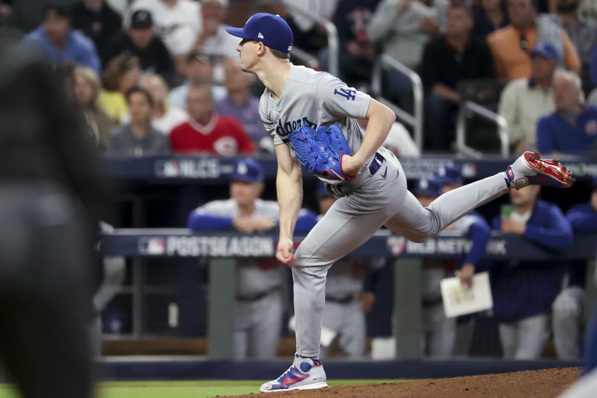 Dodgers starting pitcher Walker Buehler follows through on a pitch during the first inning.