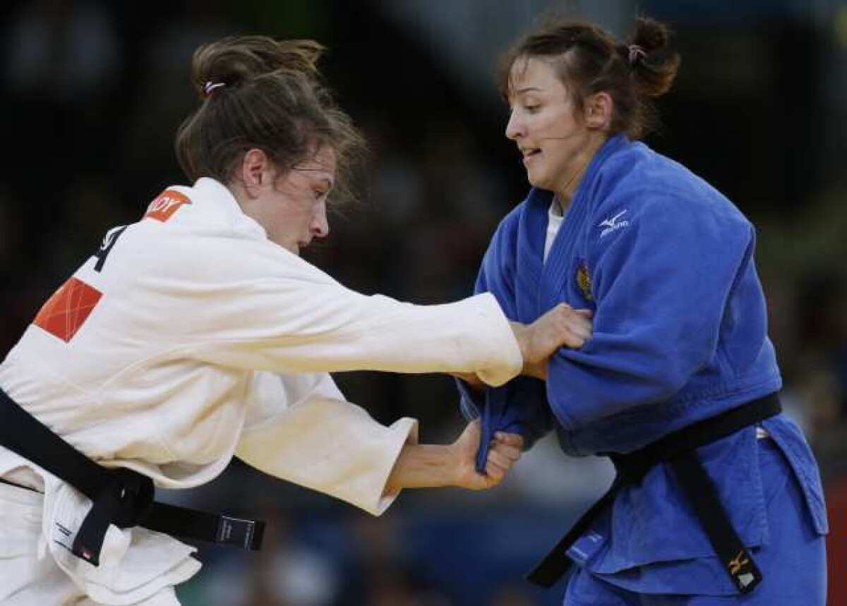 Marti Malloy, left, competes against Irina Zabdula of Russia.