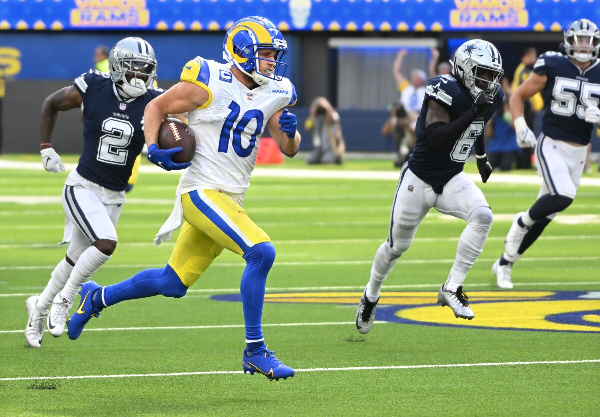 Rams receiver Cooper Kupp breaks free from the Cowboys defense to score a 75-yard touchdown in the second quarter.