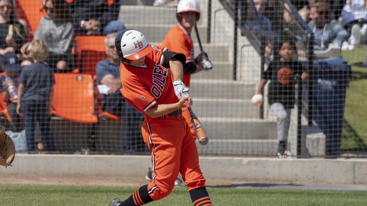 Huntington Beach High's Jake Vogel hits a solo home run in the first inning of the CIF Southern Section Division 1 first-round game against Vista Murrieta on May 18.