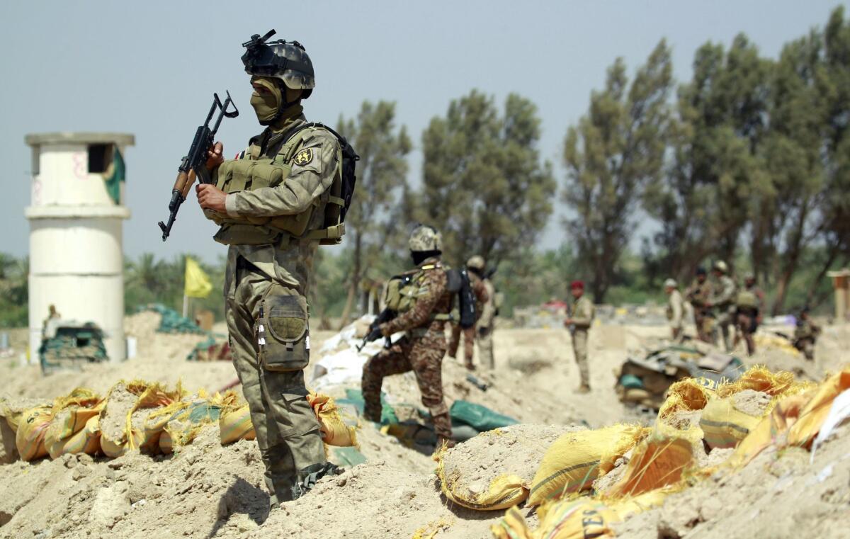 Iraqi government forces take position in the Jarf Sakhr area on May 24, trying to protect the region from Islamic State advancement.
