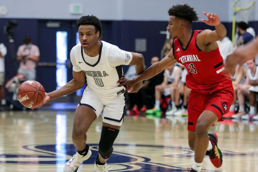 Sierra Canyon's Bronny James moves the ball up the court against Corona Centennial's Ramsey Huff.
