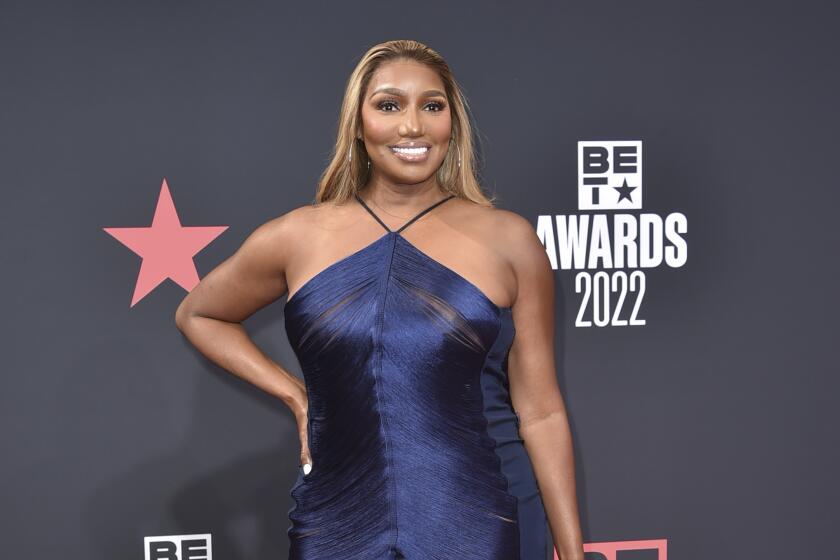 NeNe Leakes in a blue strapless gown  at the BET Awards red carpet