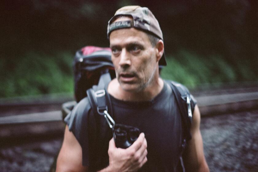 Sebastian Junger trying to figure out where to spend the night during a rainstorm west of Bolivar, PA, in 2013.