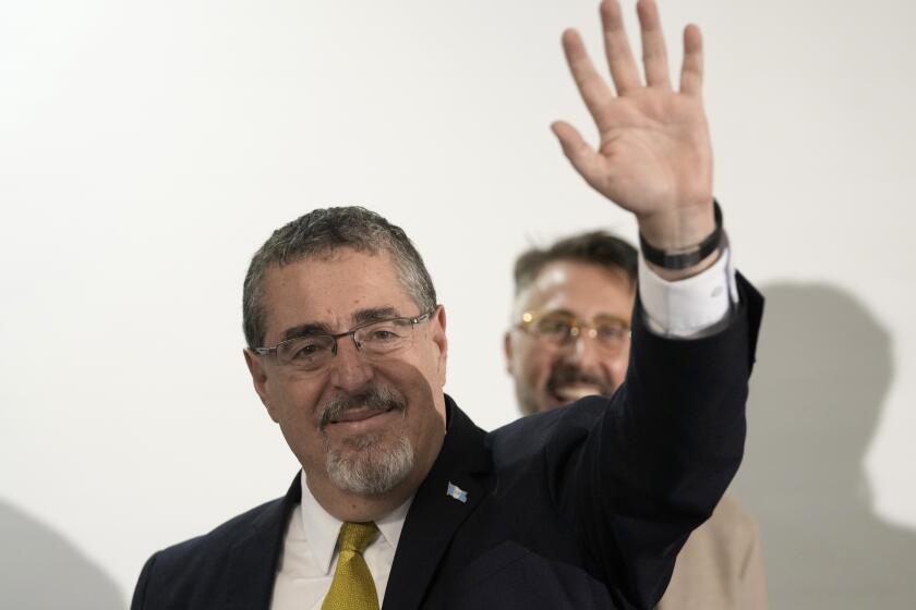 Presidential candidate Bernardo Arevalo speaks waves after preliminary results showed him the victor in a presidential run-off election in Guatemala City, Sunday, Aug. 20, 2023. (AP Photo/Moises Castillo)