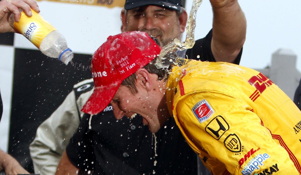 IndyCar driver Ryan Hunter-Reay is doused with Snapple after winning the Grand Prix of Alabama on Sunday.