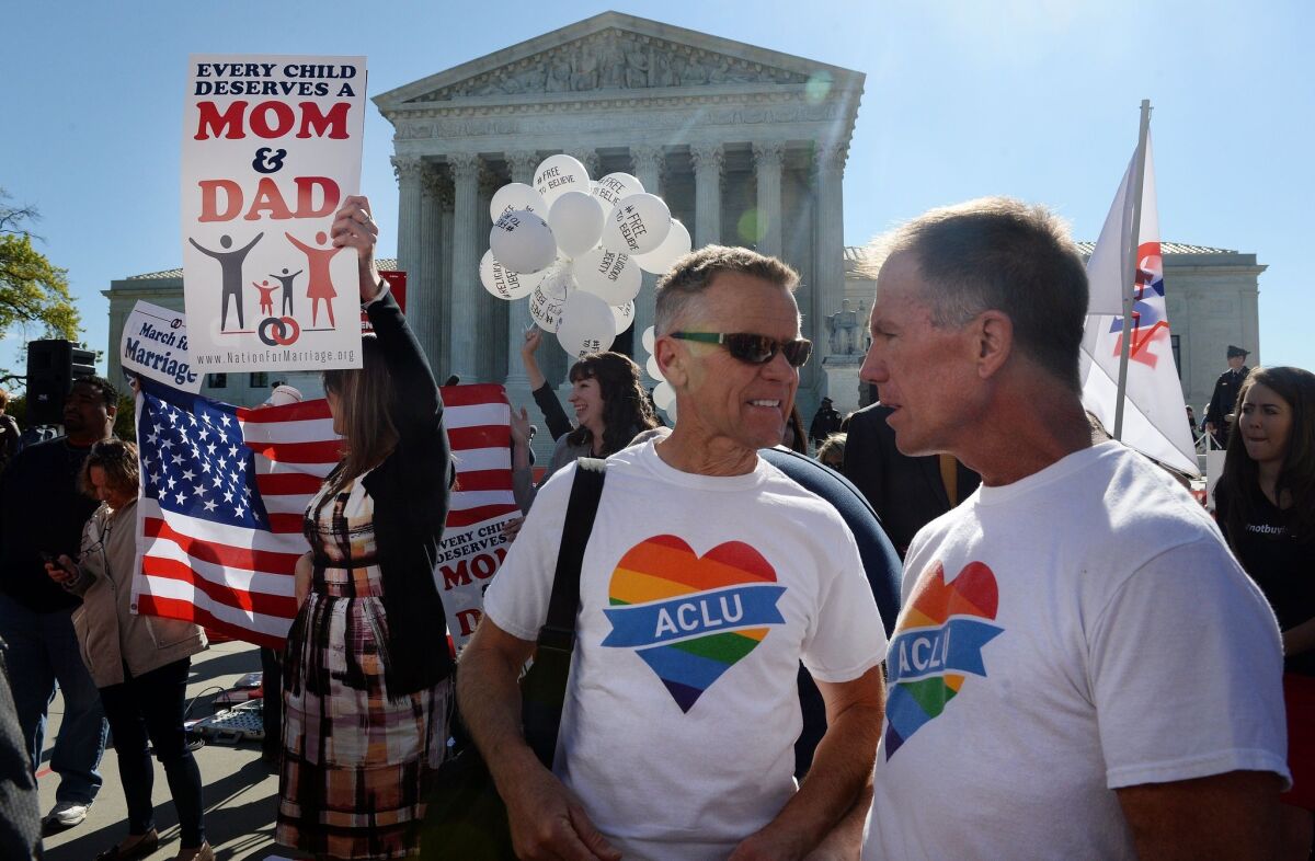 Pro- and anti-gay rights protesters outside the US Supreme Court in April during oral arguments over whether same-sex couples have a constitutional right to marry. A new Gallup poll shows a leftward shift in Americans' attitudes on social issues.