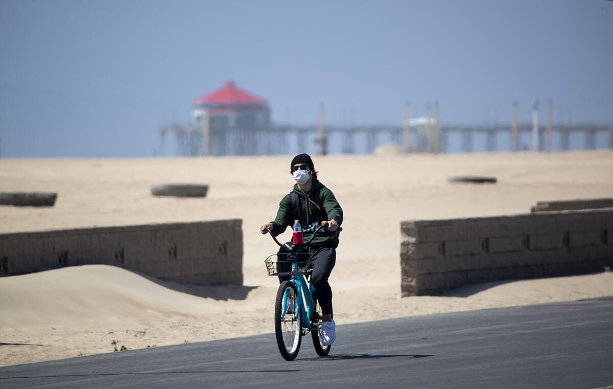 Bicyclist on the Huntington Beach boardwalk