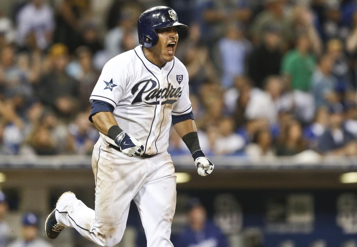 Everth Cabrera lets out a yell after hitting a deep sacrifice fly to drive in Will Venable for the game-winning score over the Dodgers.