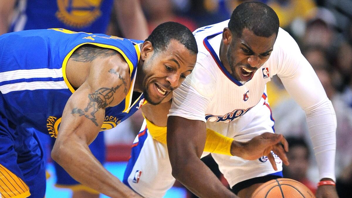 Clippers point guard Chris Paul, left, steals the ball away from Golden State's Andre Iguodala during Game 7 of the Western Conference quarterfinals last season.