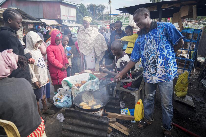 A man uses cooking oil to fry Mandazi, a type of fried bread, on a street in the low-income Kibera neighborhood of Nairobi, Kenya, Wednesday, April 20, 2022. Global cooking oil prices have been rising since the COVID-19 pandemic began and Russia's war in Ukraine has sent costs spiralling. It is the latest fallout to the global food supply from the war, with Ukraine and Russia the world’s top exporters of sunflower oil. And it's another rising cost pinching households and businesses as inflation soars. (AP Photo/Khalil Senosi)