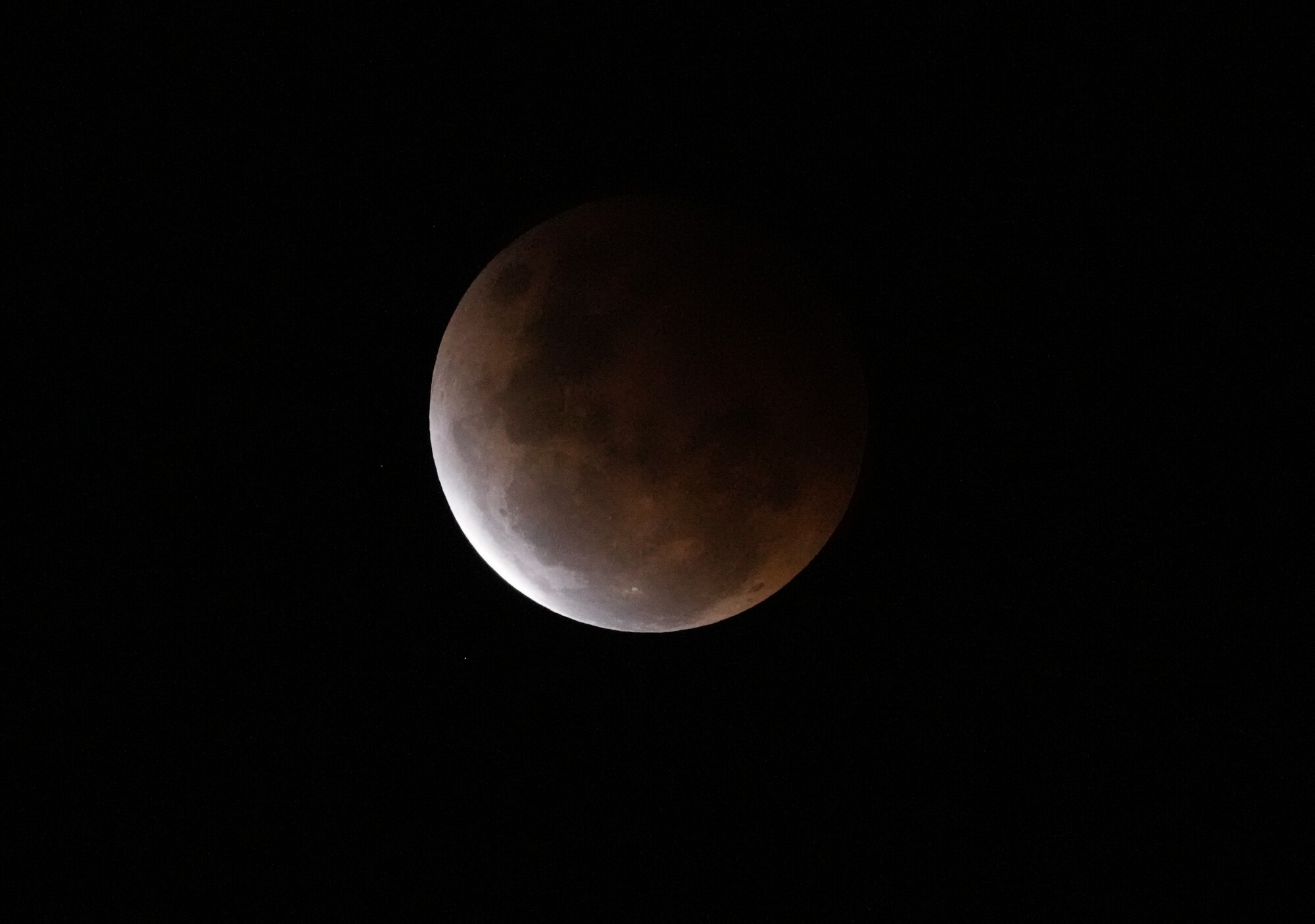 The Earth's shadow falls across the full moon