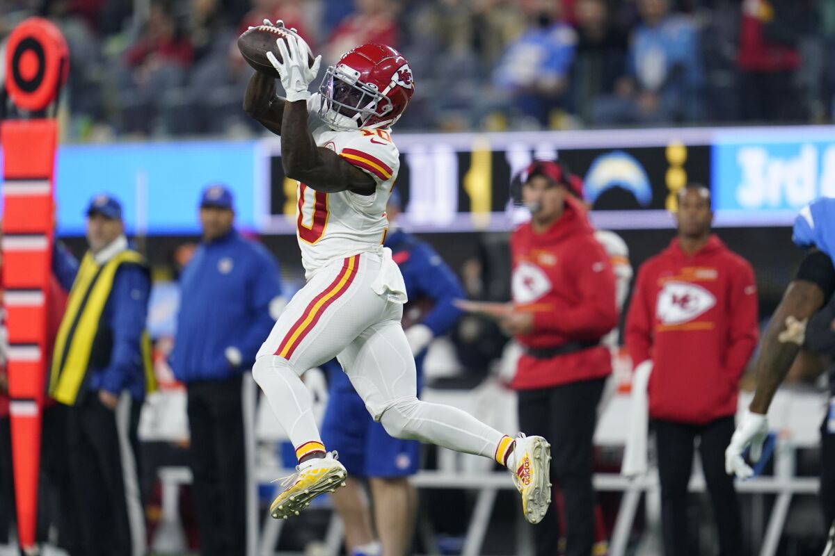 Kansas City Chiefs wide receiver Tyreek Hill makes a catch during the second half of an NFL football game against the Los Angeles Chargers, Thursday, Dec. 16, 2021, in Inglewood, Calif. (AP Photo/Ashley Landis)
