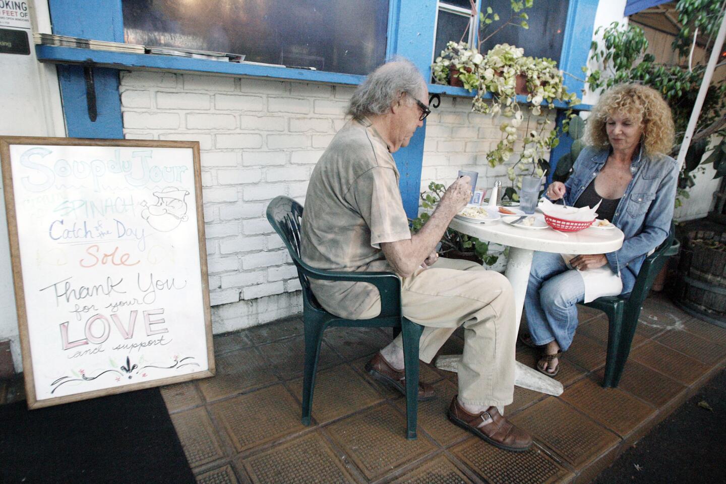 Dr. Glen Roberts, left, and his wife, Dr. Naomi Parry dine at Riverside Cafe in Burbank on Wednesday, August 22, 2012.