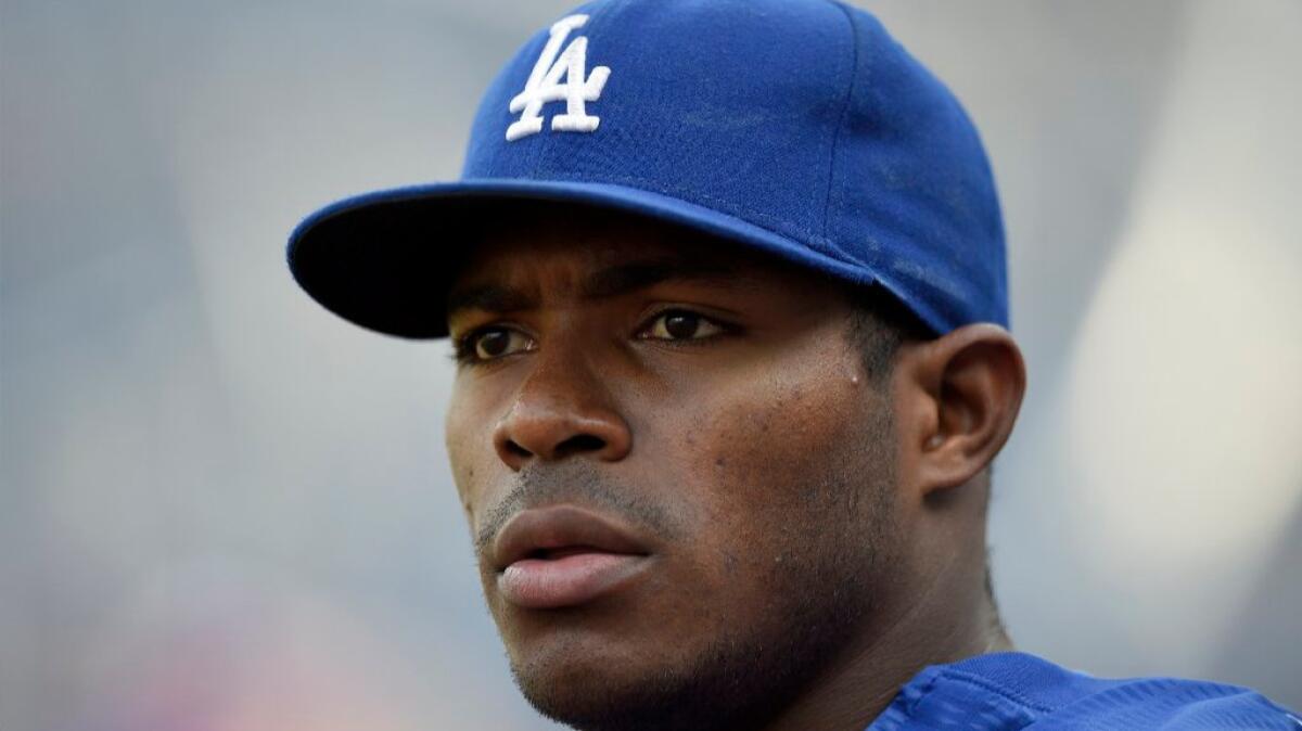 Dodgers outfielder Yasiel Puig looks on before a game against the Nationals on July 19.