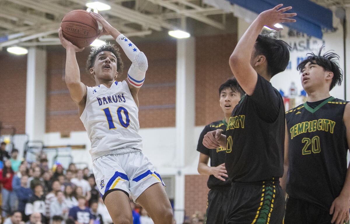 Fountain Valley's Roddie Anderson shoots over several Temple City defenders in the second round of the CIF Southern Section Division 3A playoffs on Friday.