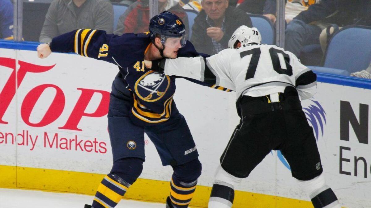 Sabres defenseman Justin Falk and Kings forward Tanner Pearson drop the gloves during a Dec. 13 game at KeyBank Center in Buffalo.