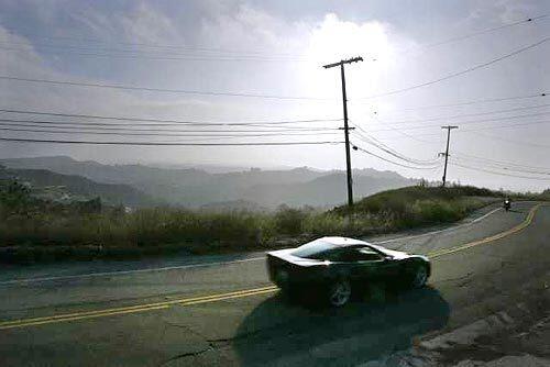 The sports cars and Mulholland Drive seem made for each other.