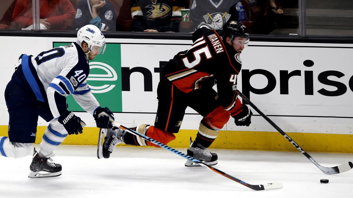 Ducks defenseman Sami Vatanen breaks away from Winnipeg Jets right wing Joel Armia during a Nov. 24 game at Honda Center.