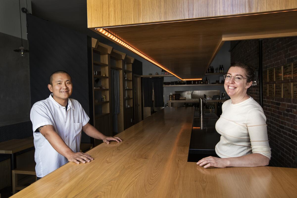 Ototo owners Charles Namba and Courtney Kaplan stand inside their Echo Park sake bar.