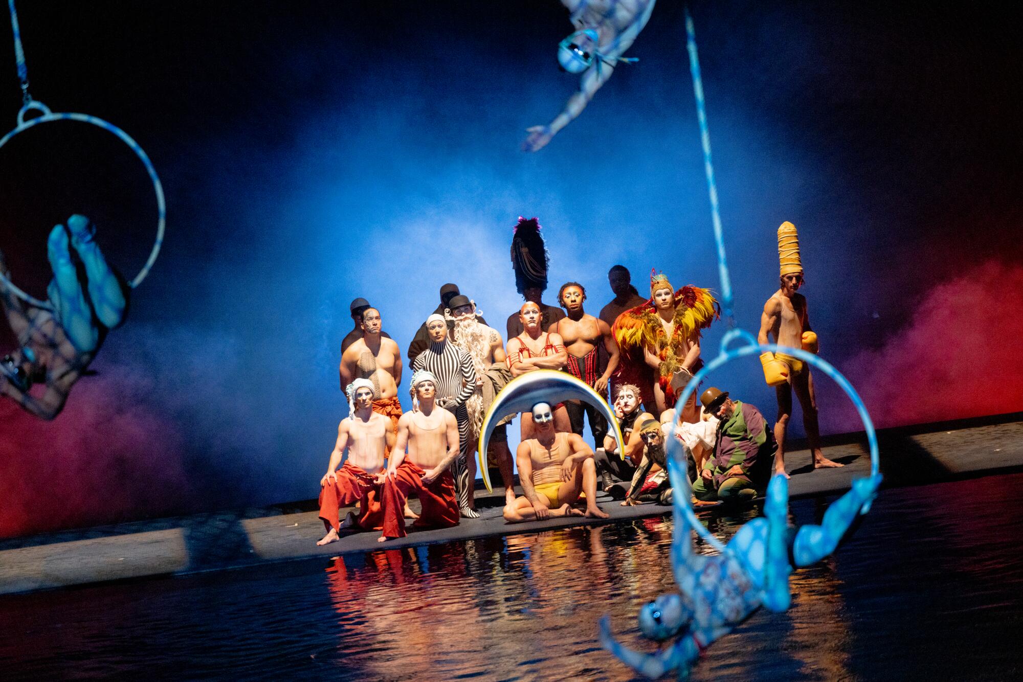 Cast members perform onstage during Cirque du Soleil's "O" at the Bellagio.