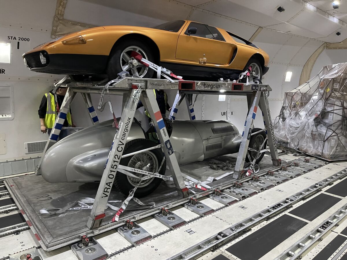 The two Mercedes are secured one atop the other to air freight pallets made of metal frames for the flight to Europe
