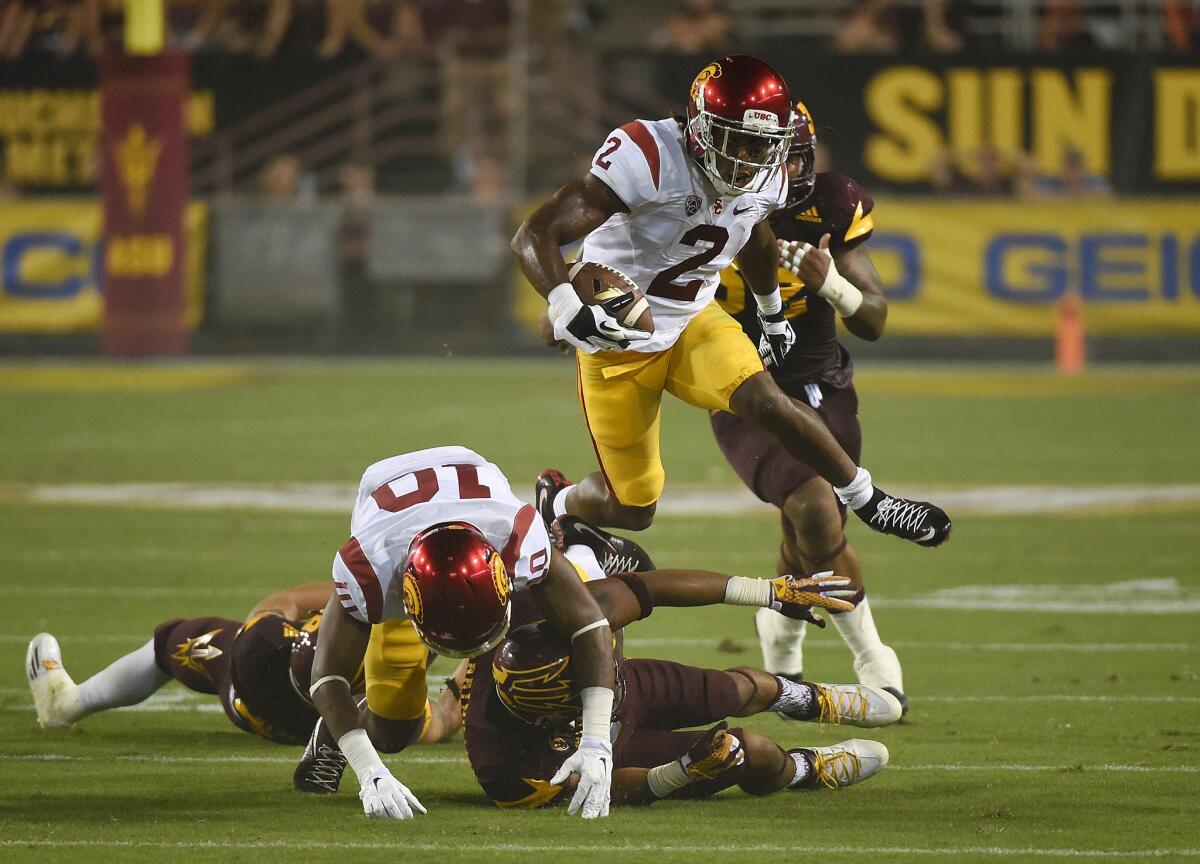 Adoree' Jackson hurdles a couple of players during a Sept. 26 game against the Arizona State Sun Devils.
