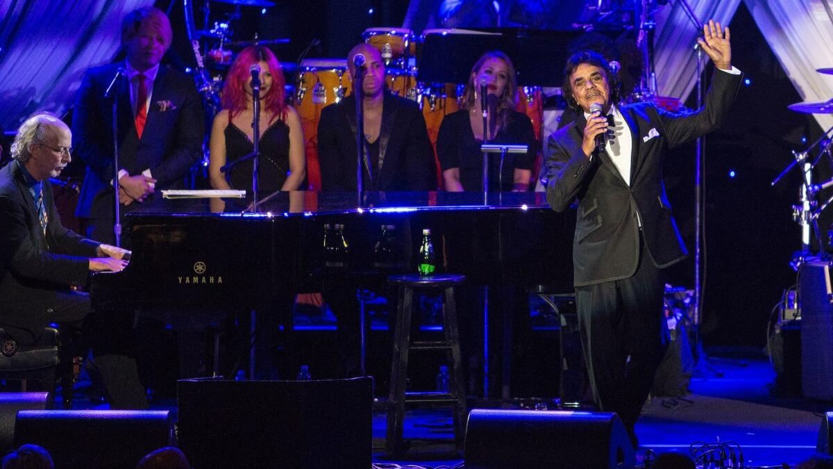 Johnny Mathis performs at Clive Davis' pre-Grammy gala at the Beverly Hilton Hotel in 2015.