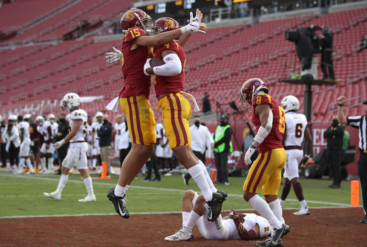 USC wide receiver Drake London congratulates Bru McCoy after his touchdown catch.