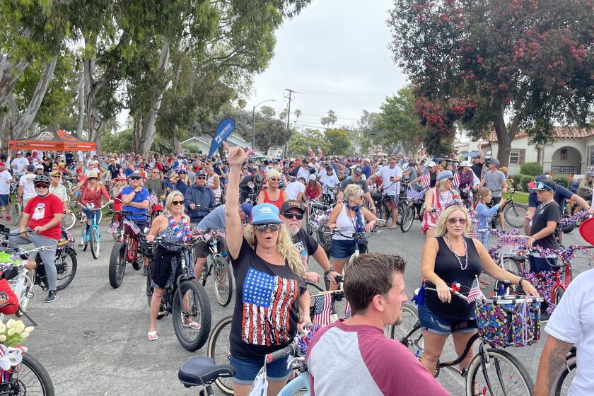 Riders enjoy the bicycle cruise in Huntington Beach in 2021.
