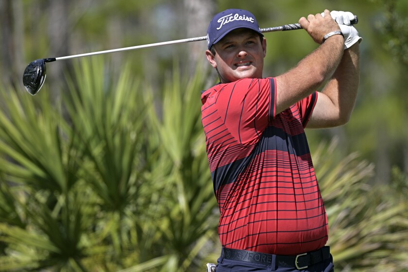 FILE - In this Feb. 27, 2021, file photo, Patrick Reed watches his tee shot on the second hole during the third round of the Workday Championship golf tournament in Bradenton, Fla. (AP Photo/Phelan M. Ebenhack, File)