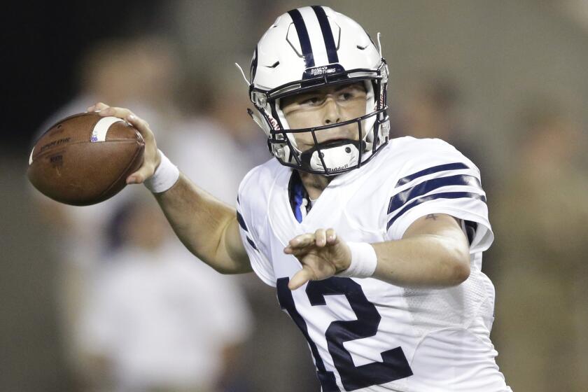 Brigham Young quarterback Tanner Mangum passes during the first half of a game against Boise State on Sept. 12.