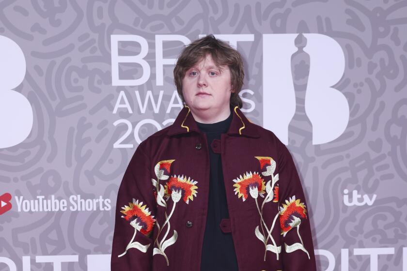 Lewis Capaldi poses for photographers upon arrival at the Brit Awards 2023 in London, Saturday, Feb. 11, 2023. 